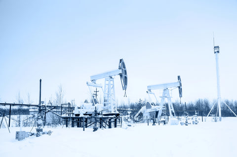 group of oil pumps in snow 